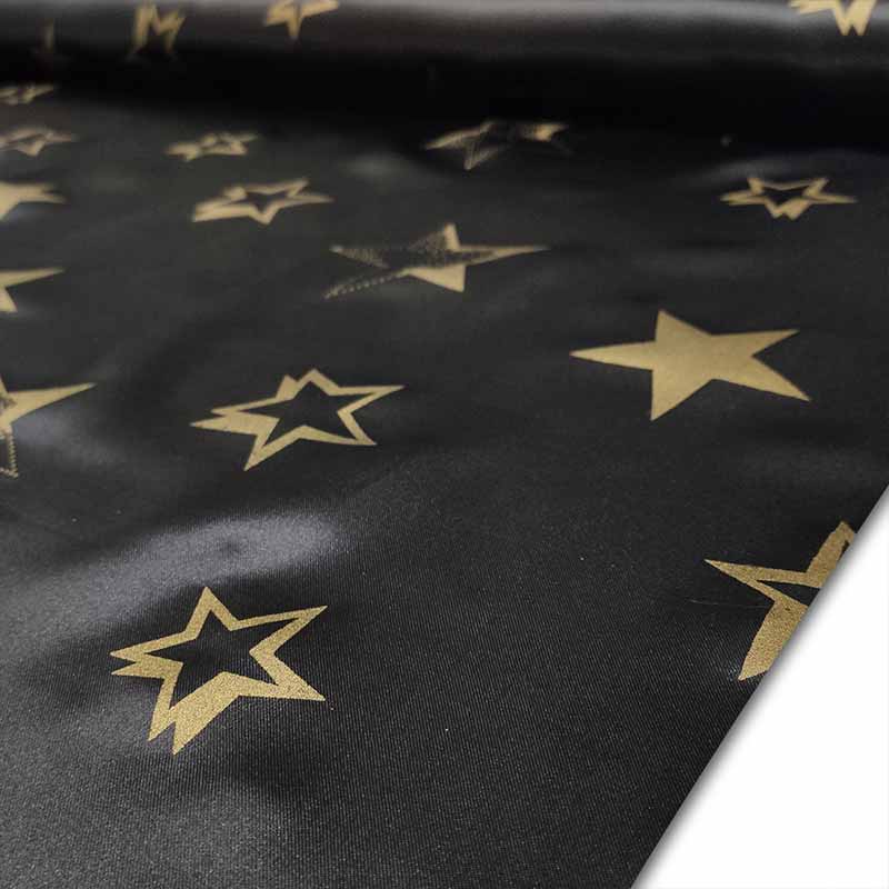 Tessuto Raso Carnevale Nero con Stelle Oro Image