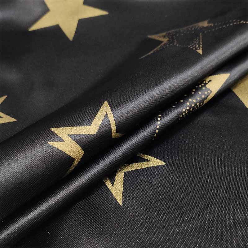 Tessuto Raso Carnevale Nero con Stelle Oro Image