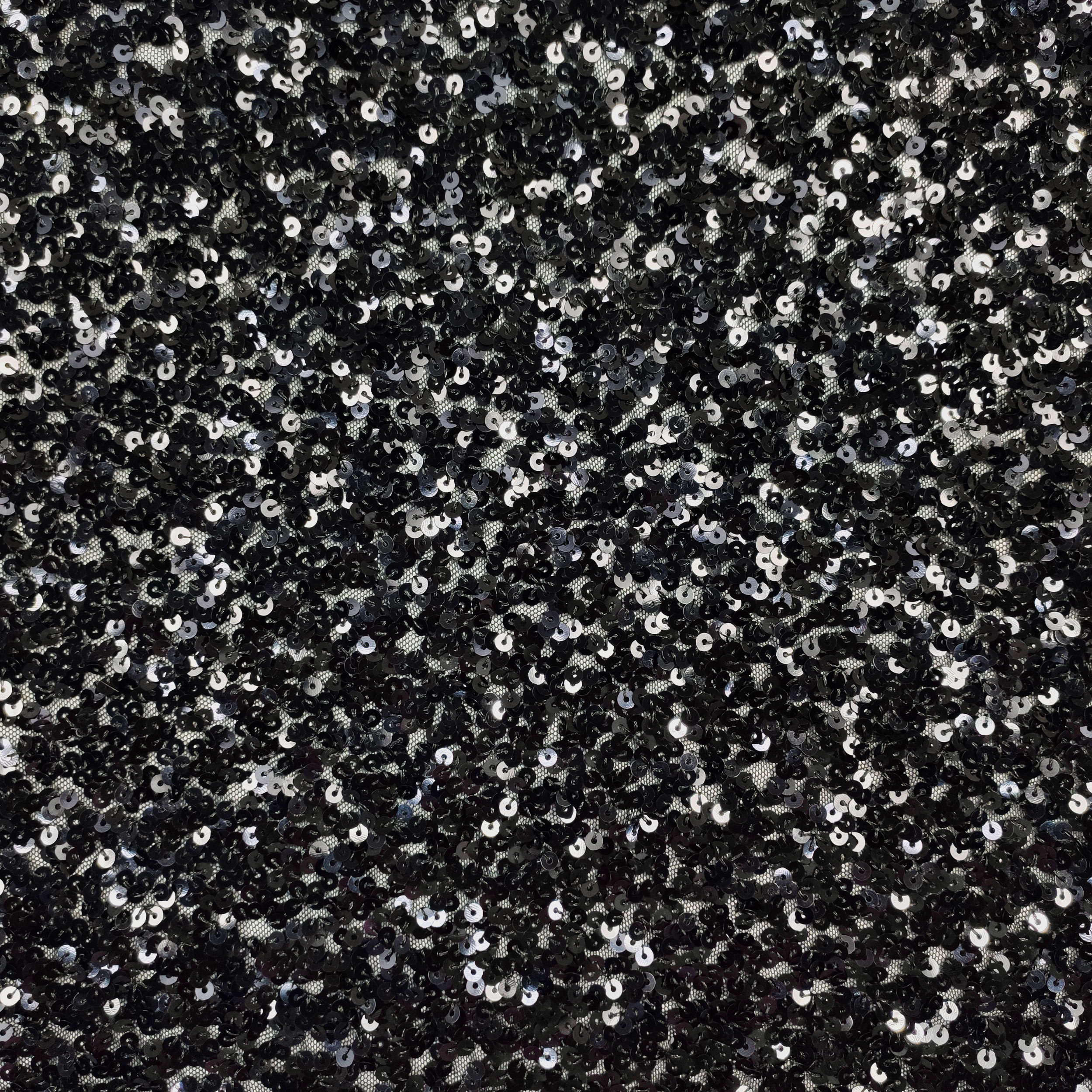 Tessuto Paillettes su Tulle Nero